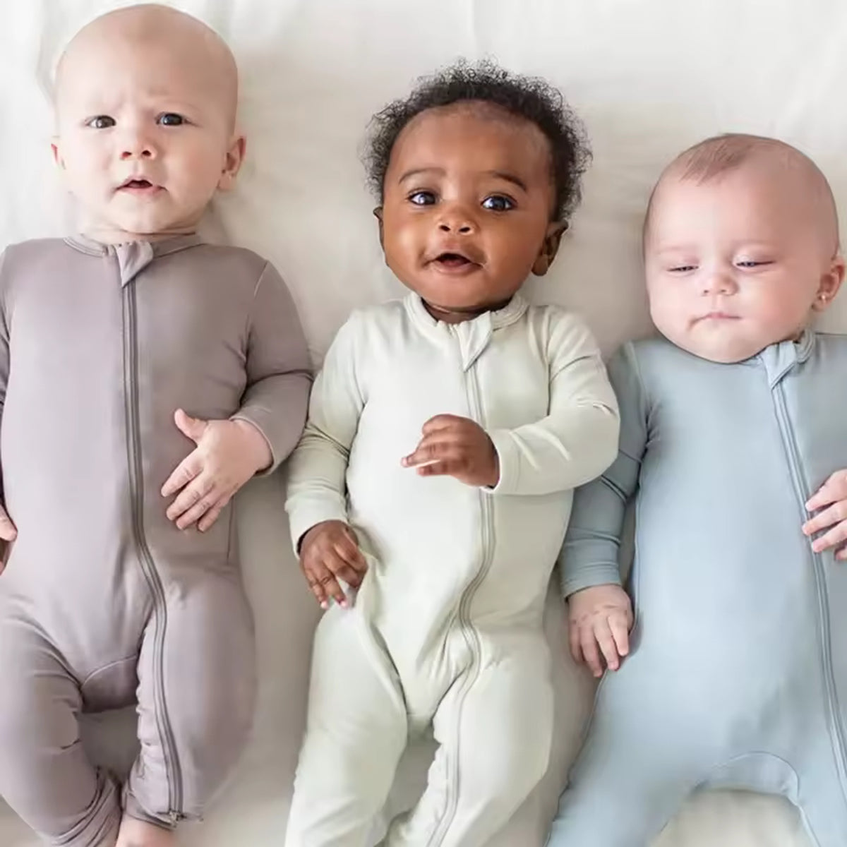 Bamboo Baby Romper worn by real babies in Beige, White, and Dusty Blue