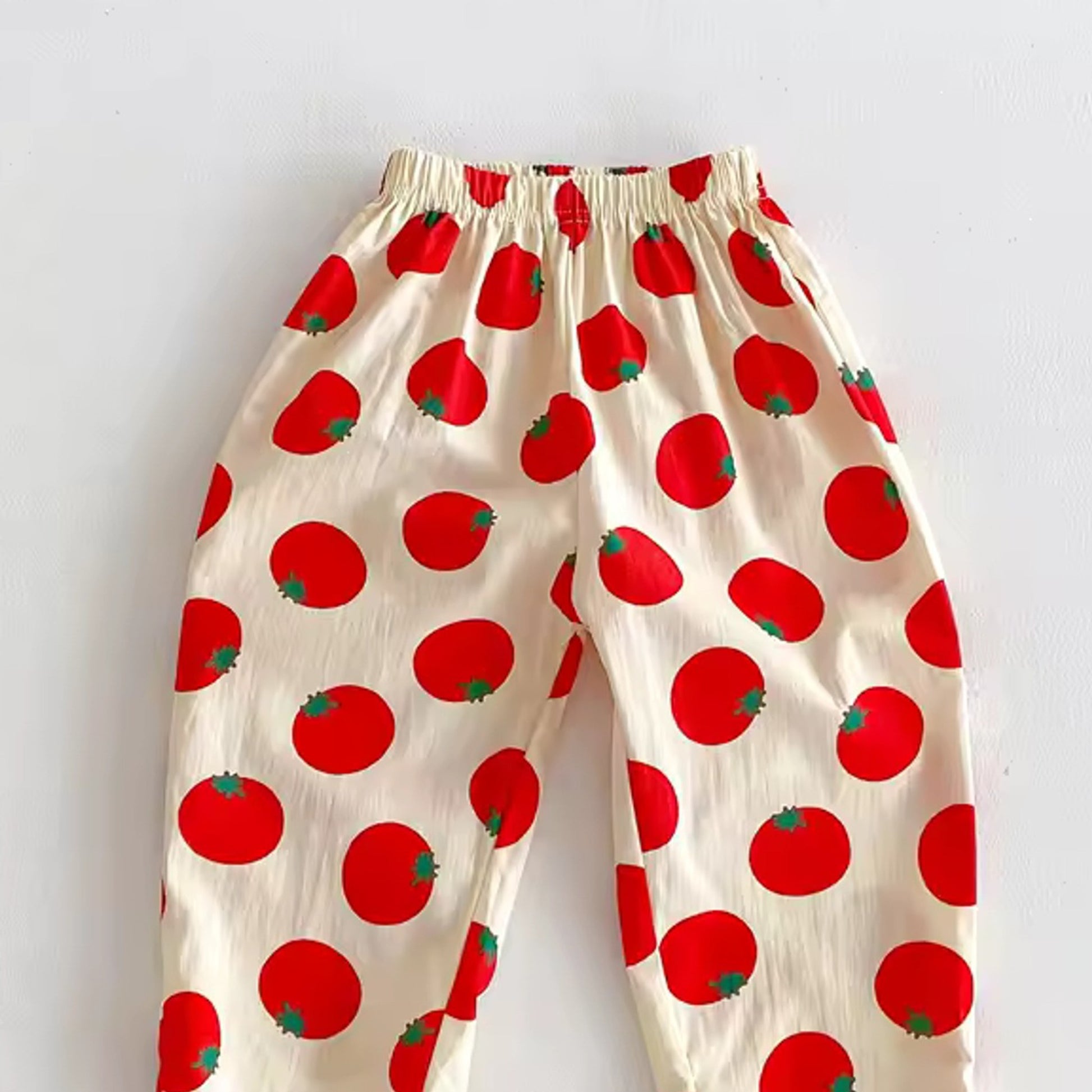Tomato Summer Pants in Cherry Medium Detail - baby and toddler pants, professional product photo