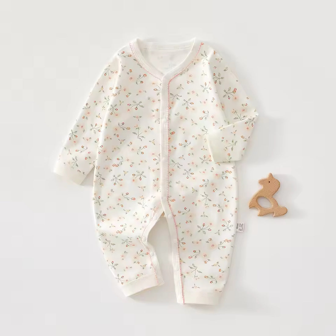 Ivory Floral Onesie - front