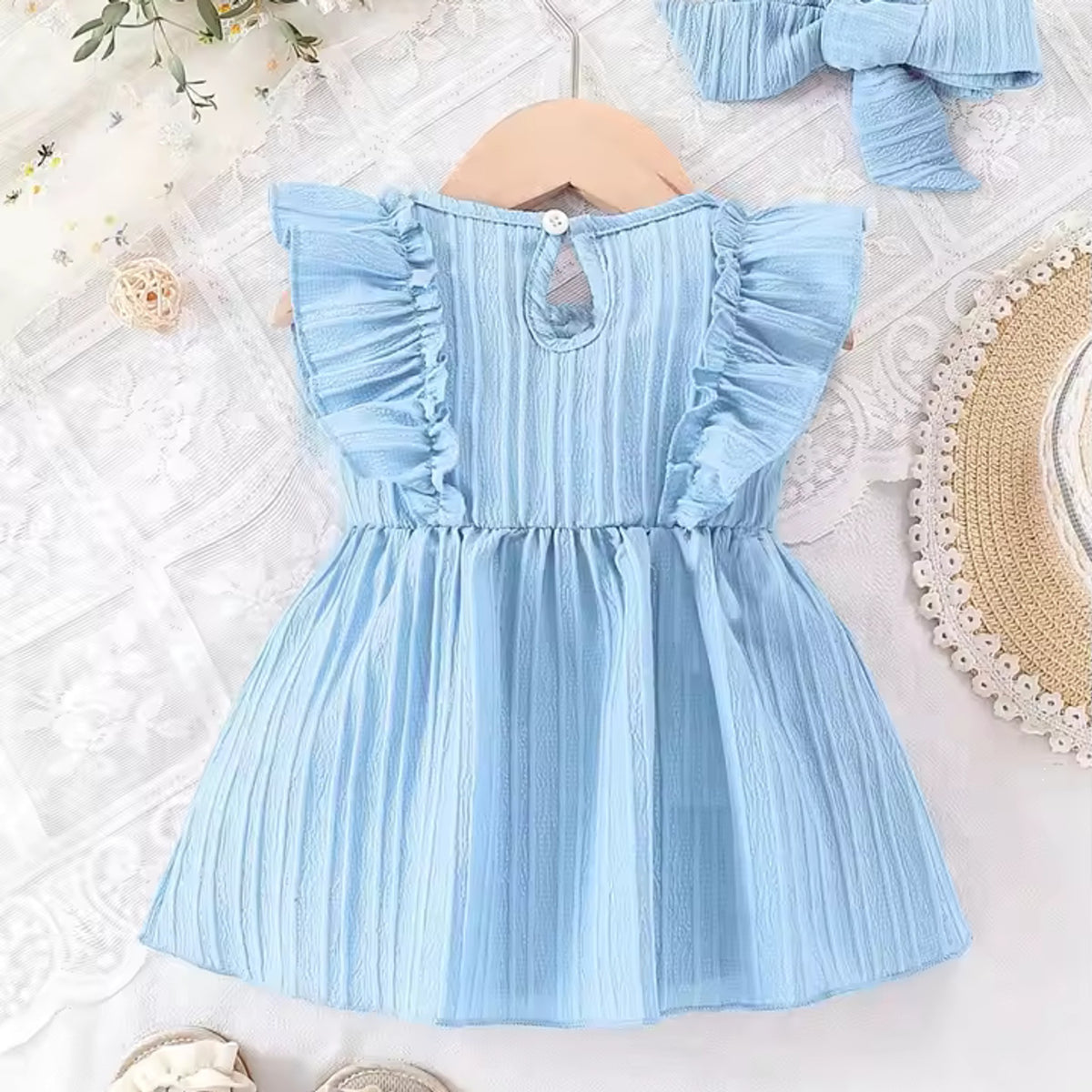 Ruffle Bow Knit Dress in Blue, back view showing button closure